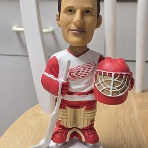 Red and White Hockey Player Figurine